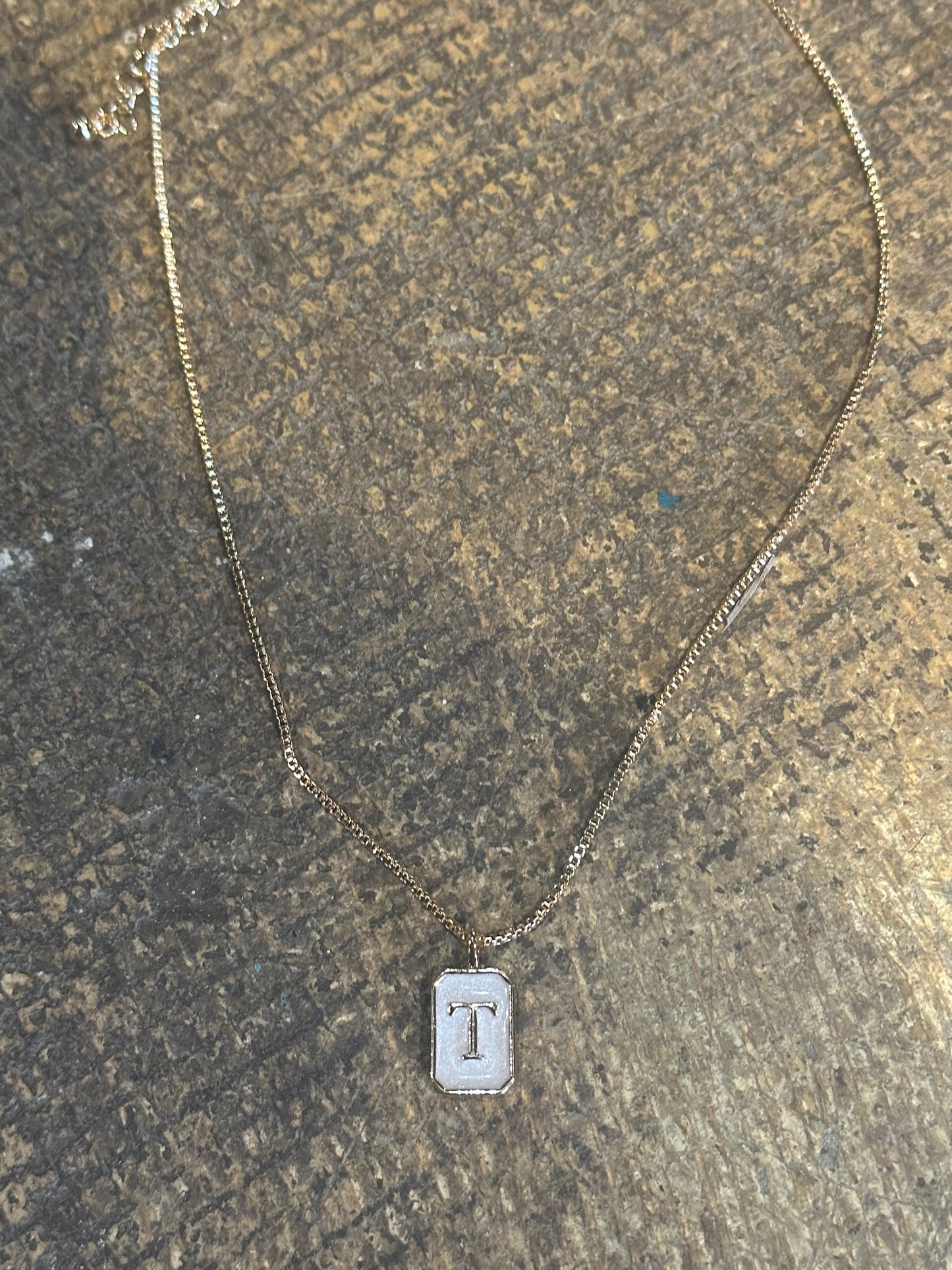 “T”